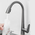Removable 304 Stainless Steel Kitchen Sink in Polished Gold, with a pull-down faucet for hot and cold water.